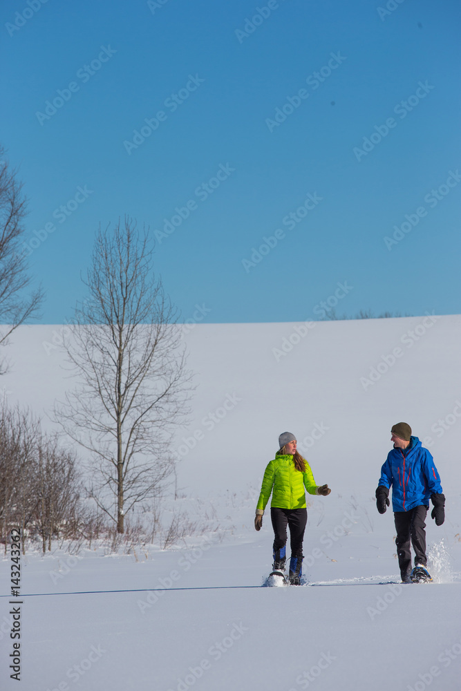 Couple Snowshoeing in fresh snow