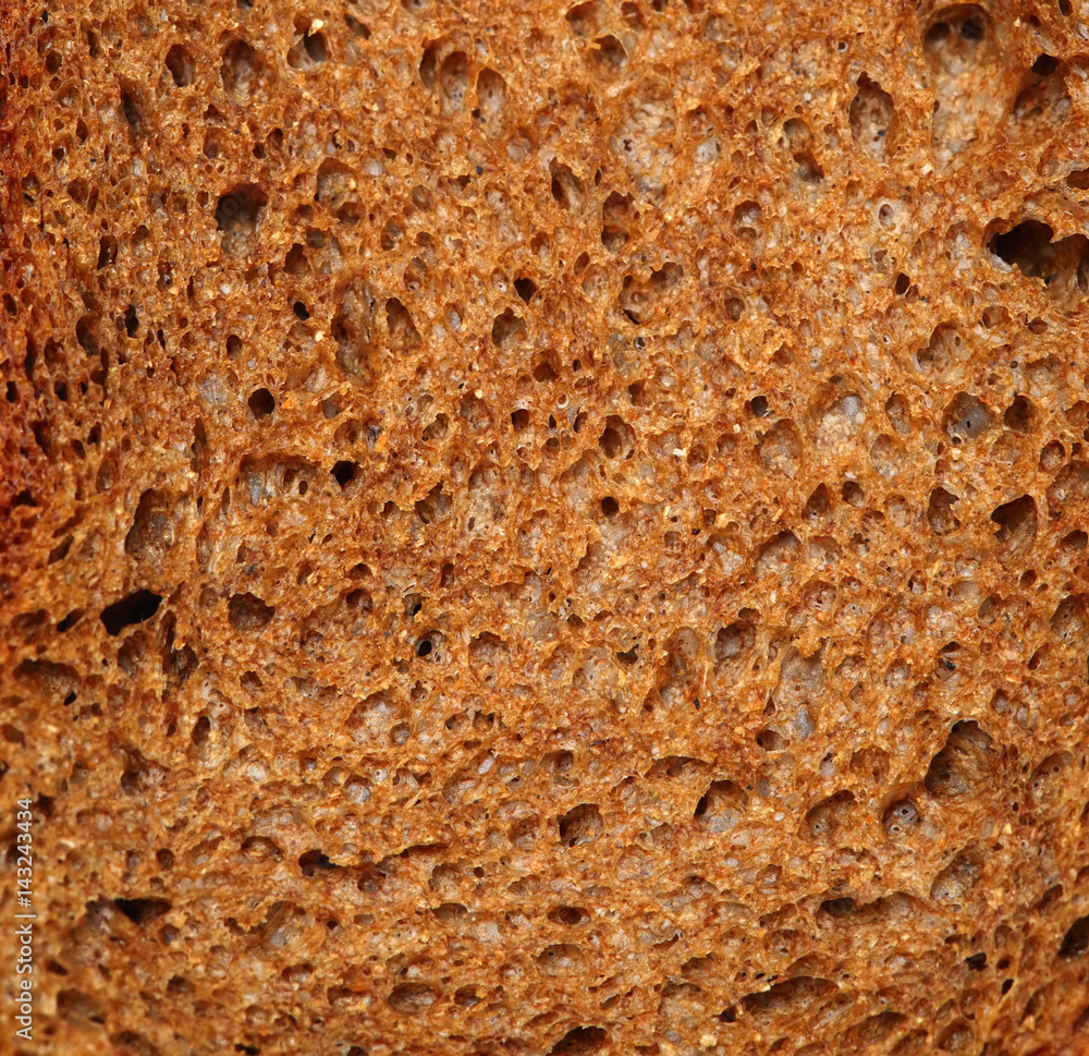 Cut of dark rye bread closeup