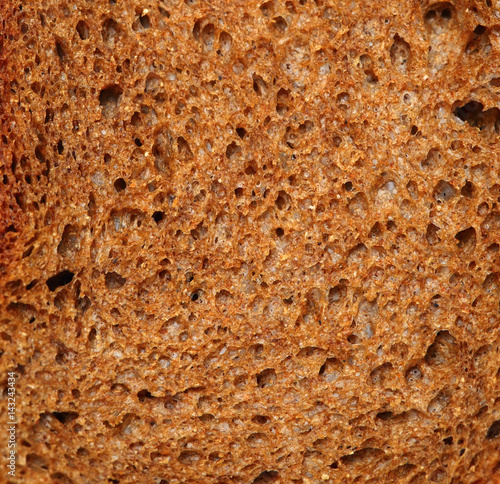 Cut of dark rye bread closeup