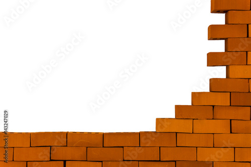 A brick wall under construction. Brick masonry isolated on white background.