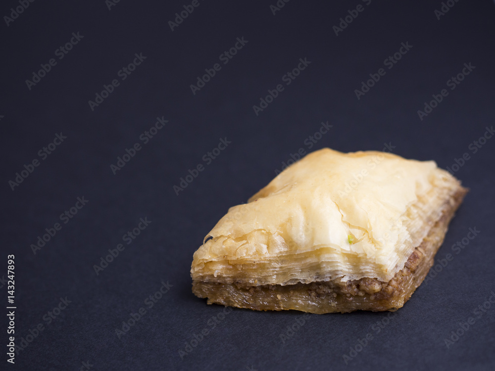 Baklava with nuts isolated on black background Baklava with nuts isolated on black background