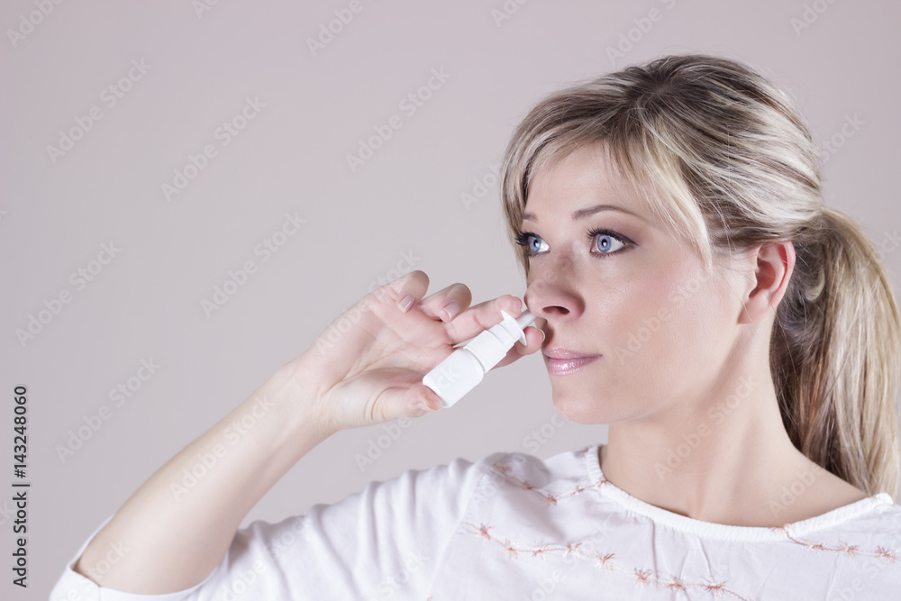Nasal Spray. Closeup Of Beautiful Young Woman's Face With Nasal Drops. Nasal Spray. Closeup Of Beautiful Young Woman's Face With Nasal Drops.
