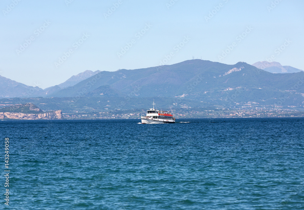  Ferry boat on  Lake Garda. Garda Lake is one of the most frequented tourist regions of Italy.