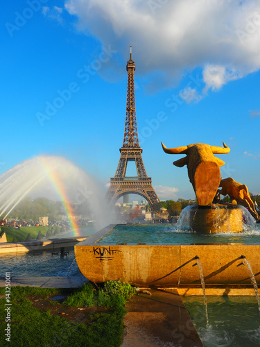 Beautiful Scene in front of Eiffel Towe, including Rainbow and amazing Sky