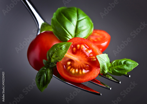  Tomato cherry slices and green basil
