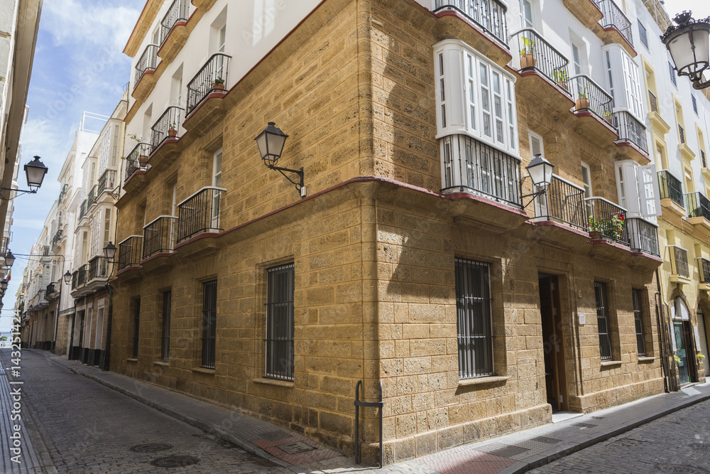 Narrow street with traditional architecture in Cadiz, Andalusia, southern Spain Narrow street with traditional architecture in Cadiz, Andalusia, southern Spain