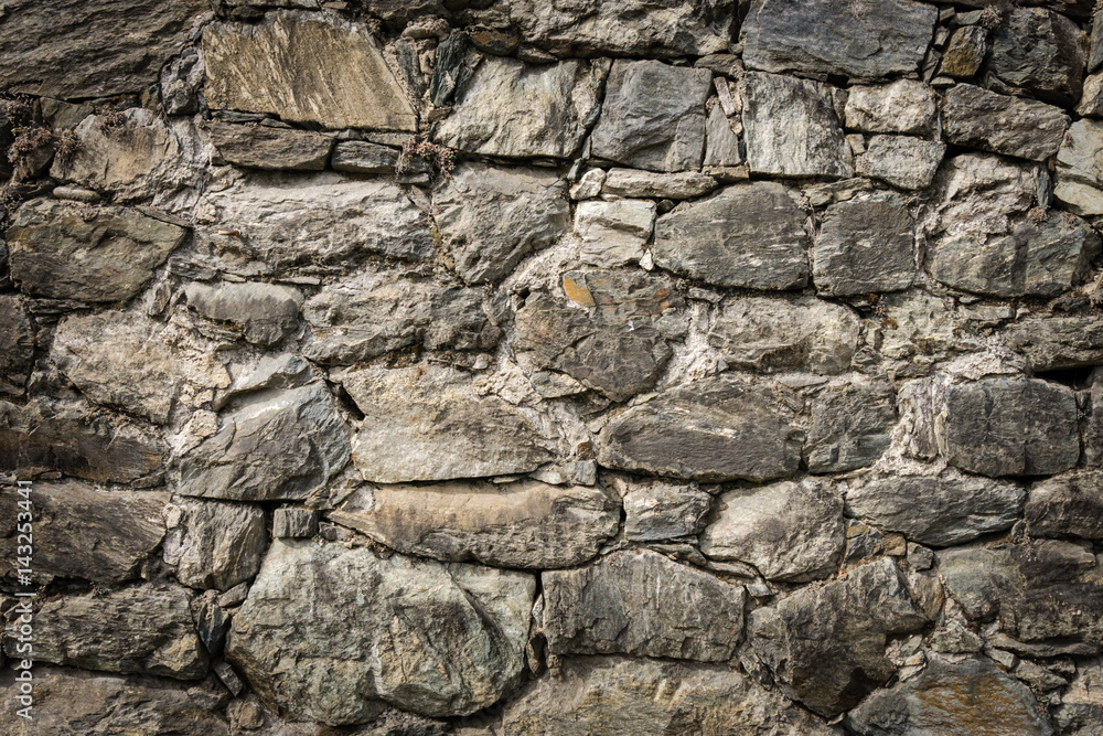Masoned rock wall of natural stones with nice vignetting Masoned rock wall of natural stones with nice vignetting