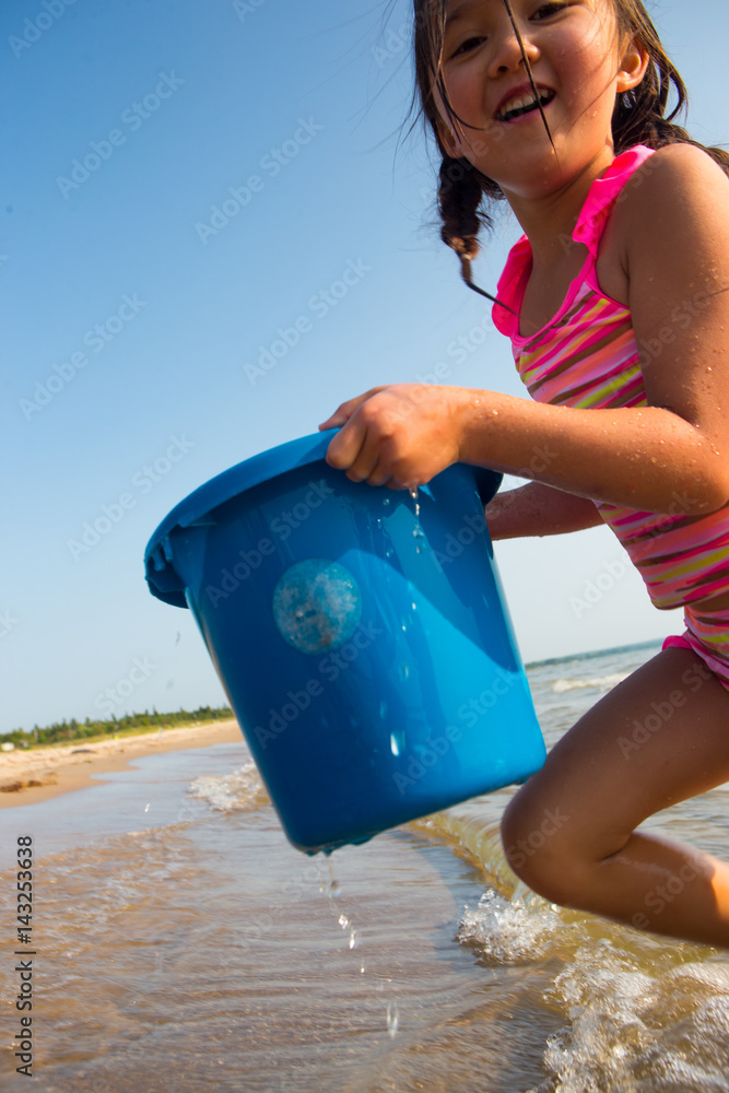Girl playing on the beach