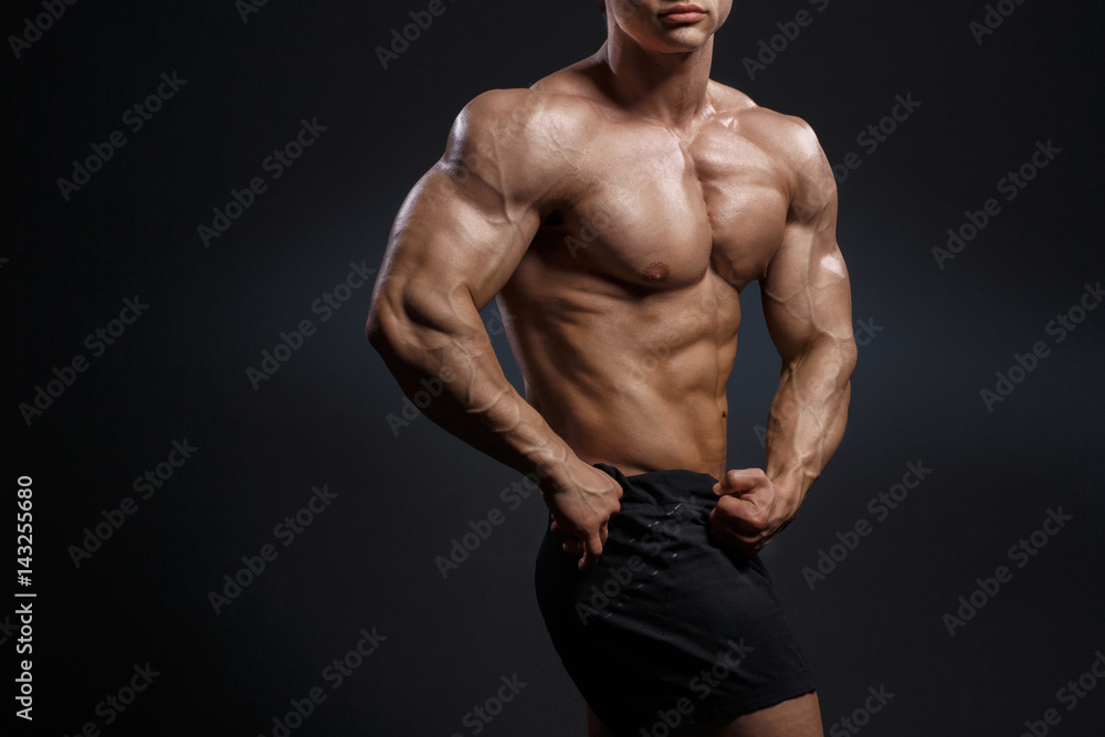 Fototapeta premium Handsome power athletic young man with great physique