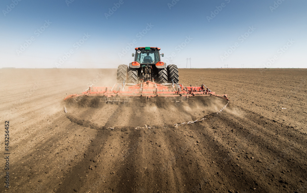 Fototapeta premium Tractor preparing land