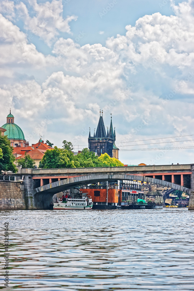 Fototapeta premium Charles Bridge with Tower over Vltava River in Prague