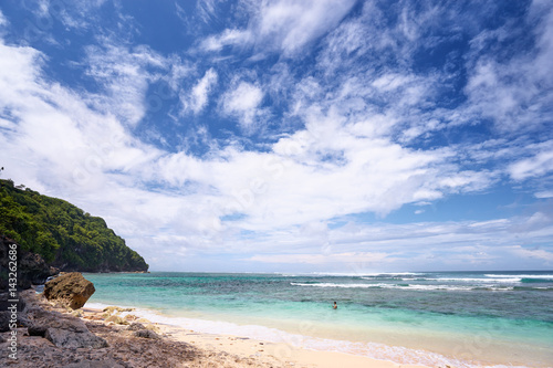Beautiful seascape. Beach with blue cloudy sky.