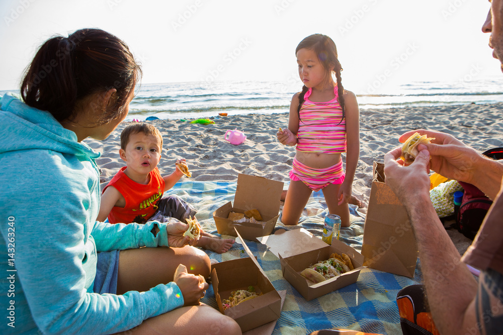 Mixed race family at the beach