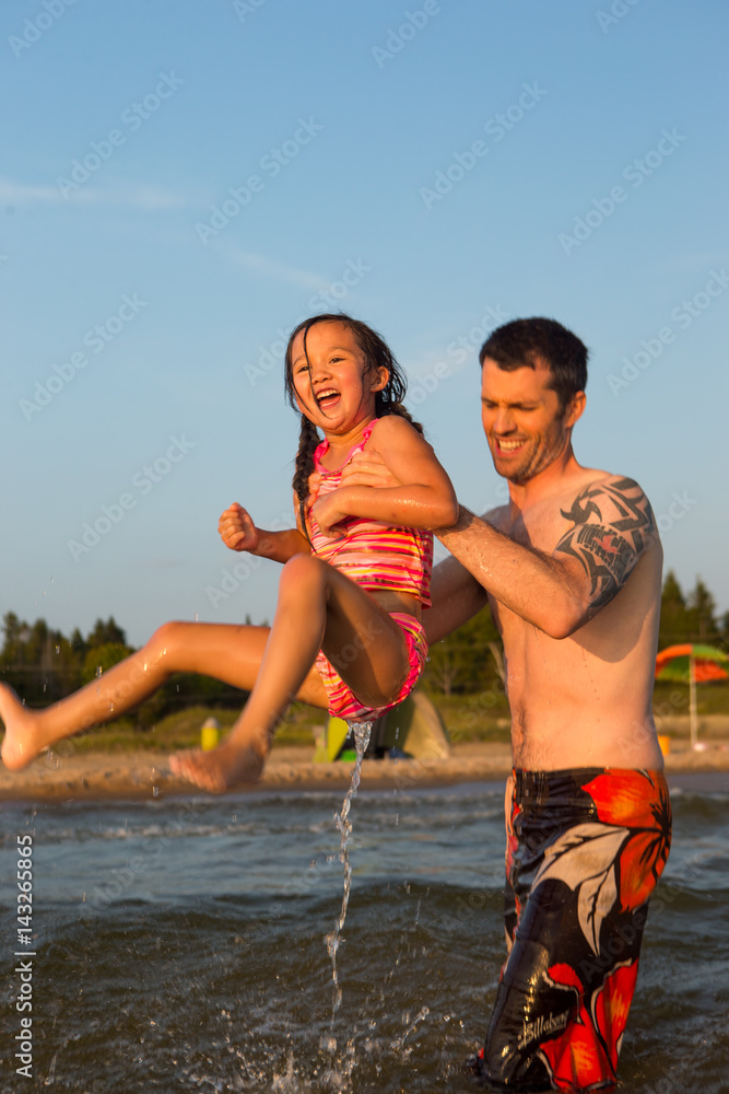 Obraz premium Mixed race family at the beach