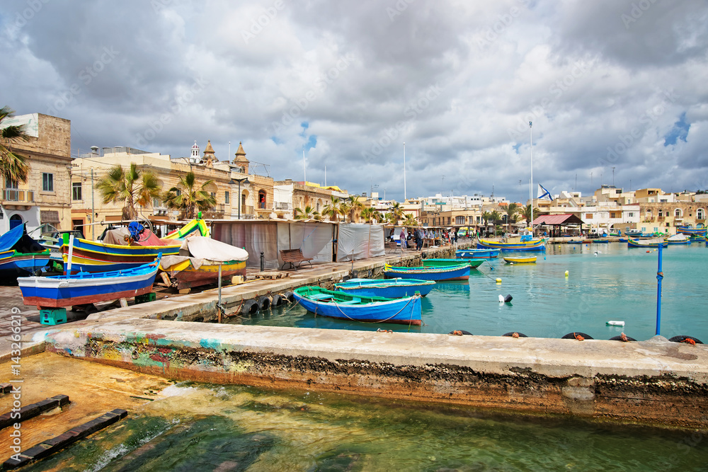 Luzzu colorful boats on Marsaxlokk Harbor Malta