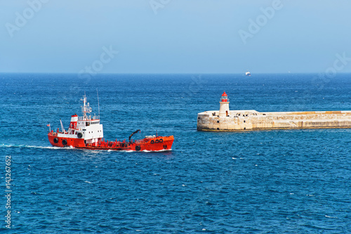Dry cargo vessel and Breakwater at Fort Ricasoli of Kalkara