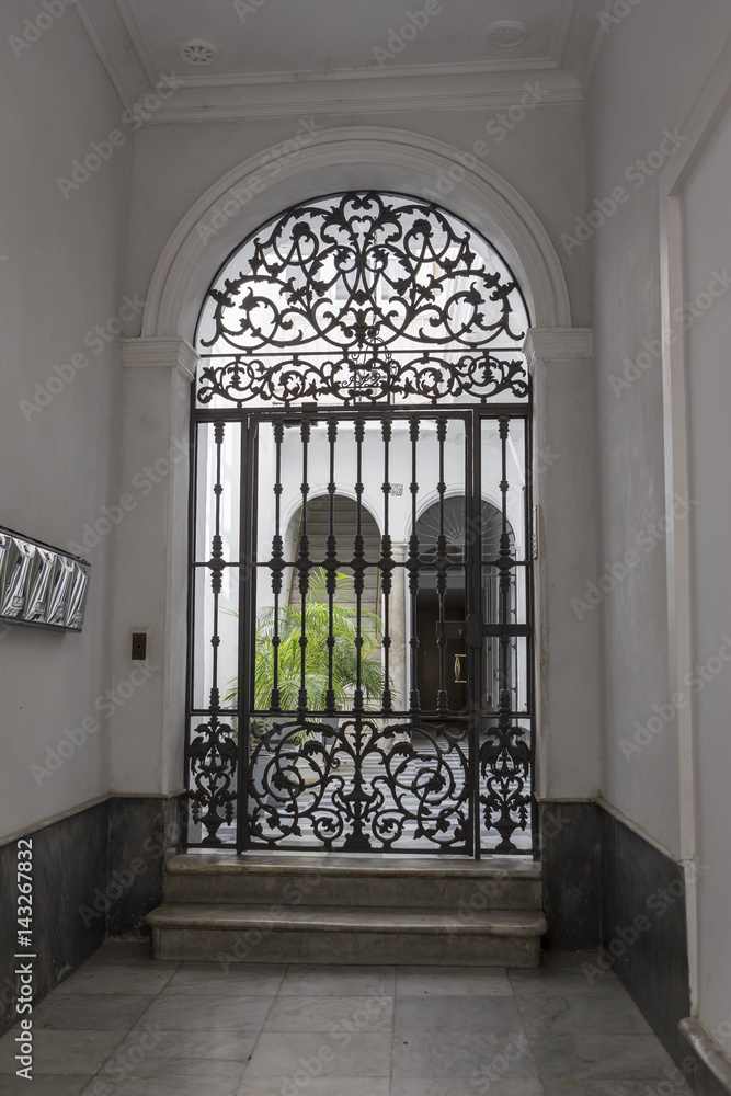 Obraz premium entry to typical house of this city, popular architecture of the XIXth century, traditional architecture in Cadiz, Andalusia, southern Spain