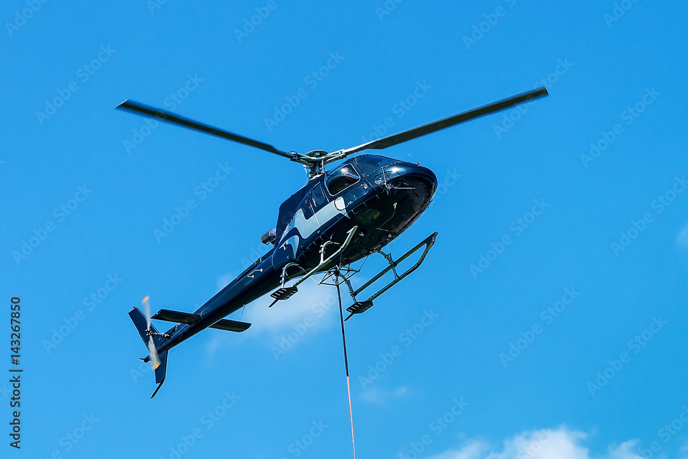 Fototapeta premium Helicopter flying in sky in Lavaux Switzerland