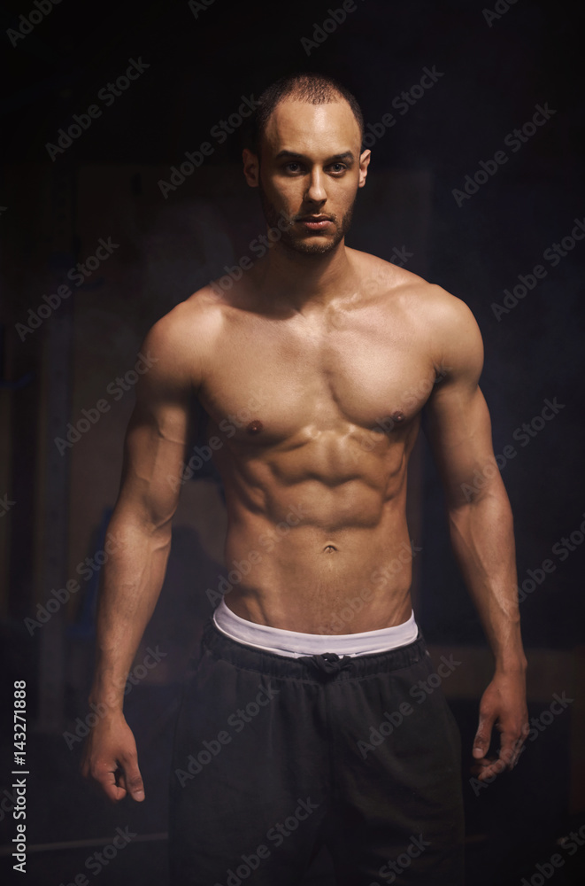 Studio shot of man prepared for gym session Studio shot of man prepared for gym session