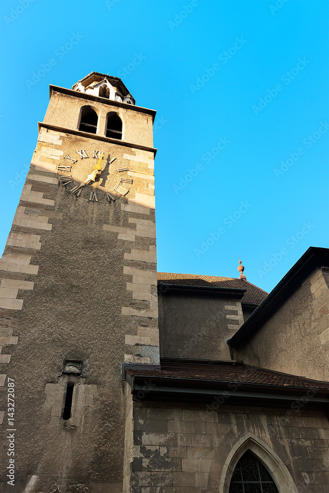 Clock tower of Madeleine Church in old town of Geneva
