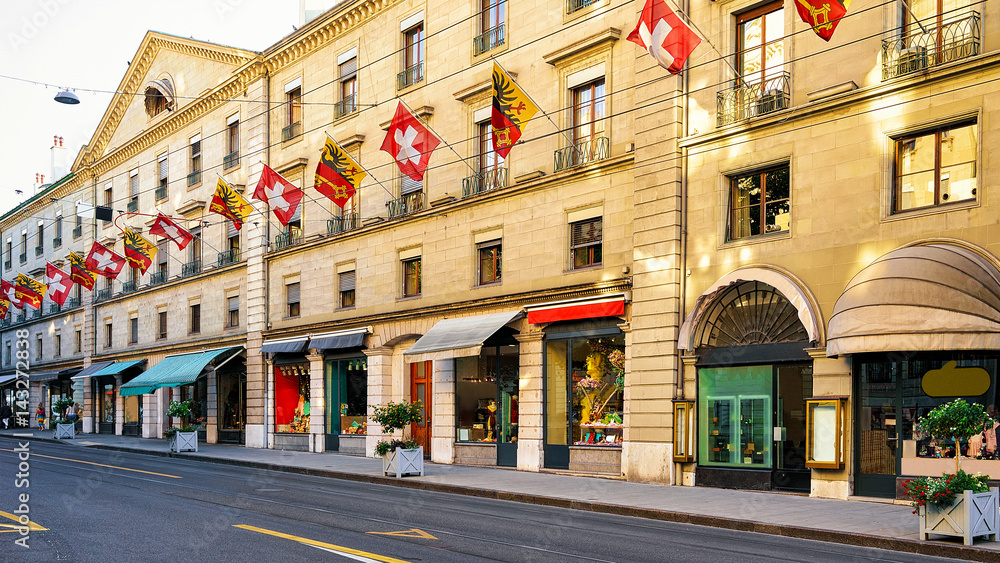 Rue Corraterie Street with Swiss flags of Geneva