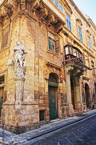 Sculpture of Saint at corner of street in Valletta © Roman Babakin