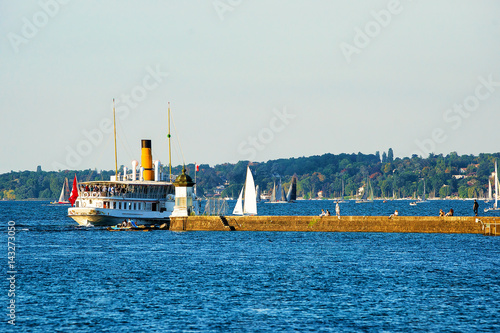 Steamboat on Geneva Lake at pier in summer in Switzerland