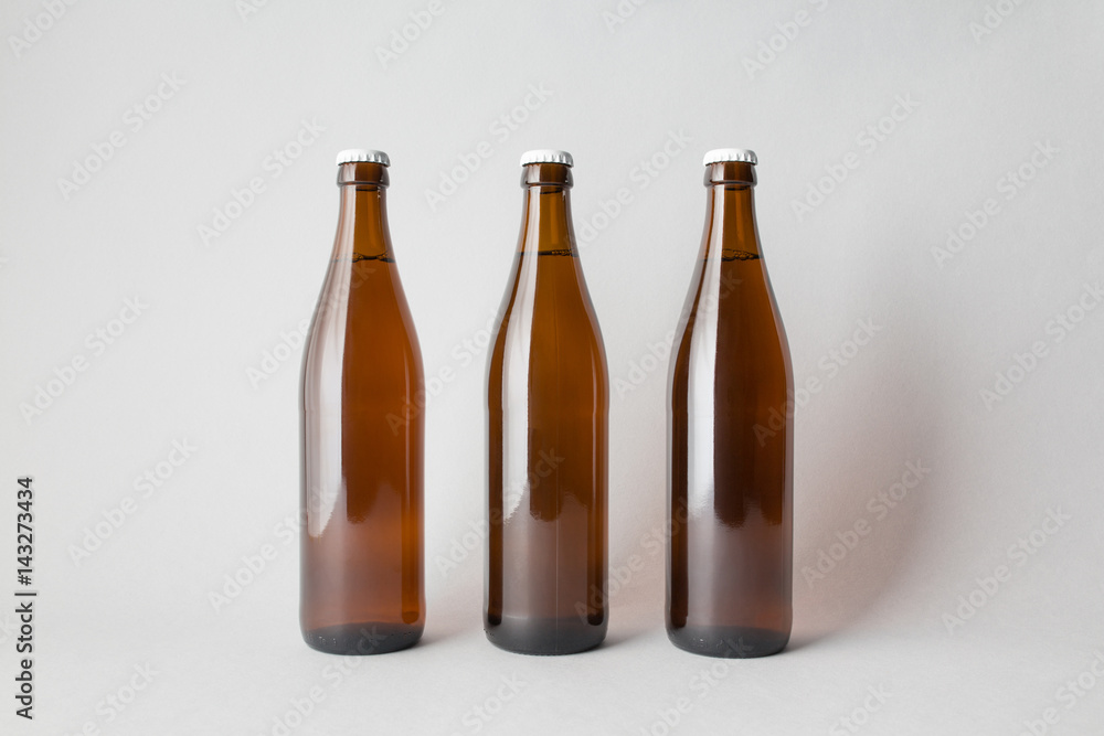Three beer bottles on the scene, mock-up. Three beer bottles on the scene, mock-up.