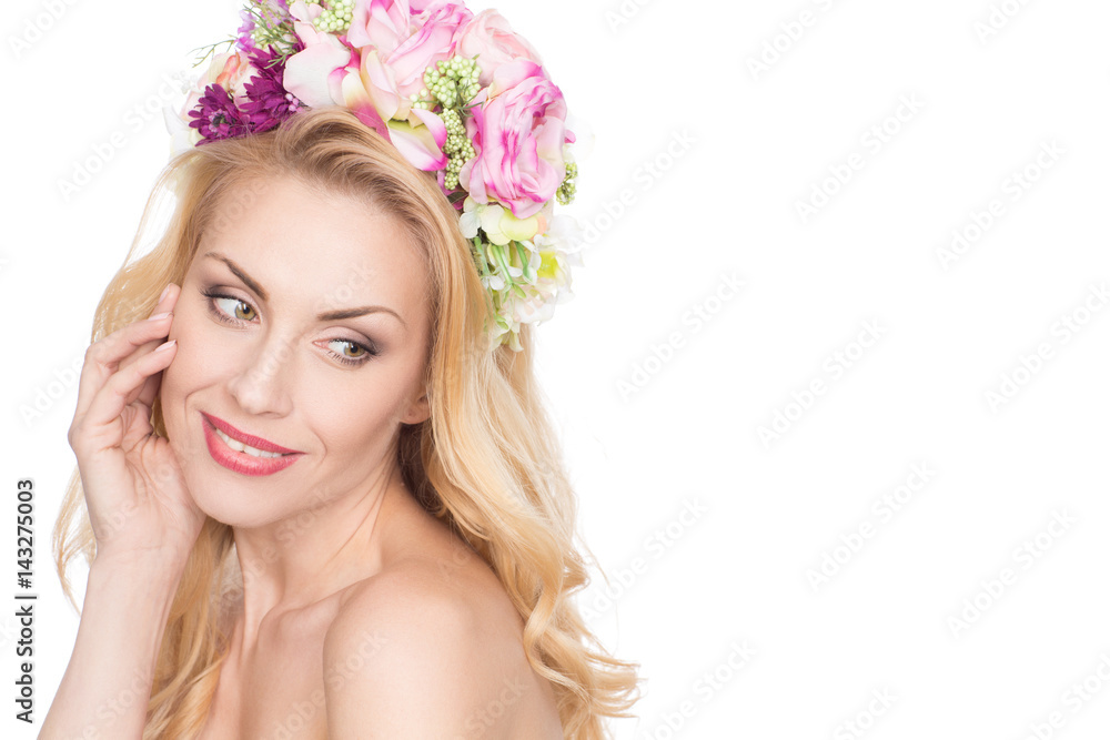 Madam Spring. Mature woman with flowers in her hair touching her face sensually looking away copyspace on the side isolated on white Madam Spring. Mature woman with flowers in her hair touching her face sensually looking away copyspace on the side isolated on white