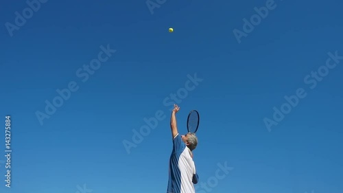 tennis player serves super slow motion low angle view