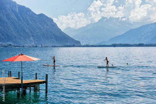 Couple with Standup paddle board on Geneva Lake Montreux