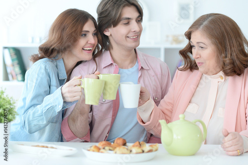 Happy family drinking tea together © aletia2011