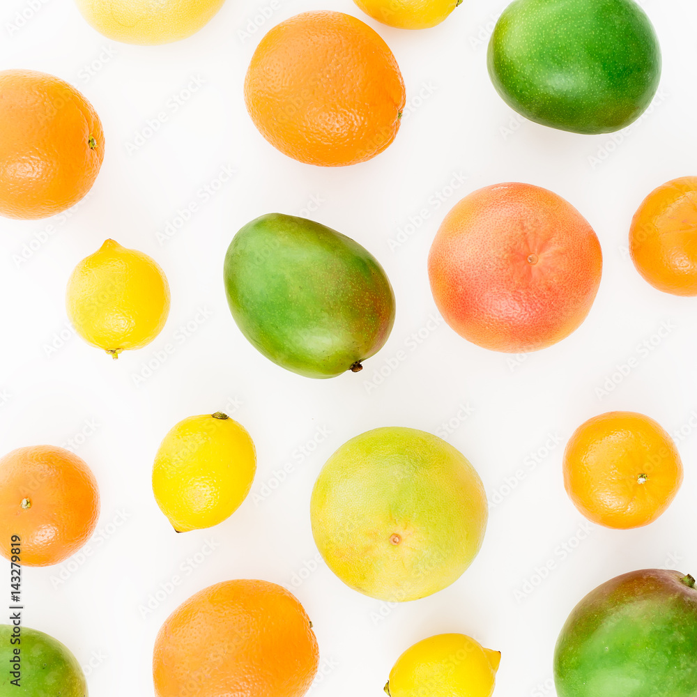 Citrus and mangos on white background. Flat lay, top view. Food background Citrus and mangos on white background. Flat lay, top view. Food background