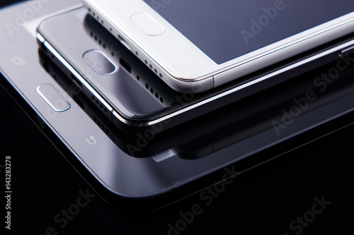 Wallpaper Mural tablet and smartphone on black background Torontodigital.ca