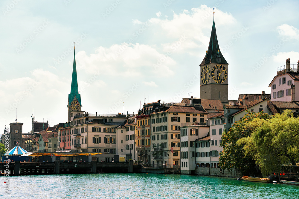 Limmat River quay and Saint Peter and Fraumunster Church Zurich