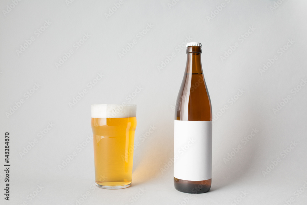 The composition of one beer bottle and one full glass of beer The composition of one beer bottle and one full glass of beer