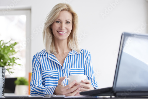 Confident professional businesswoman working on a new project at office