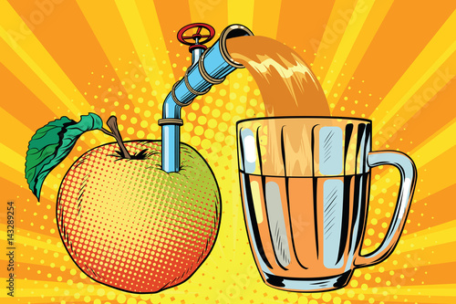 Apple juice is poured into a mug