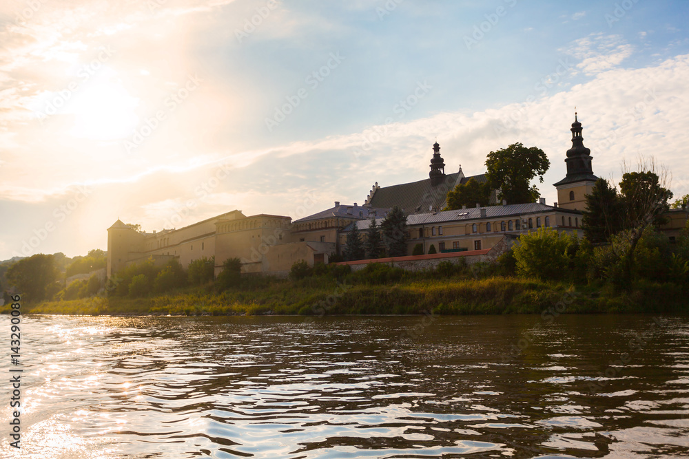 View of the church from the Vistula River in Krakow against the backdrop of the setting sun. Poland