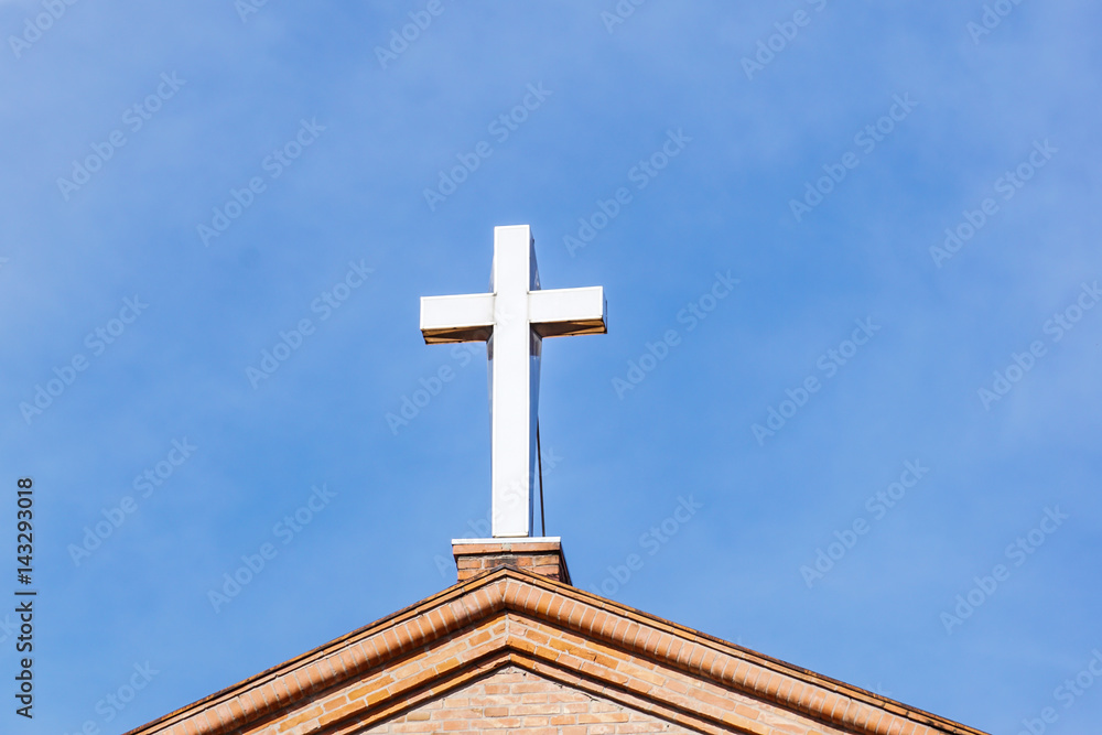 Cross on Modern Christian Church Under Blue Sky