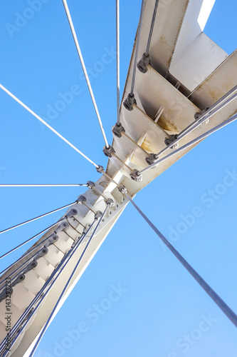 Cables and tower of the suspension bridge .
