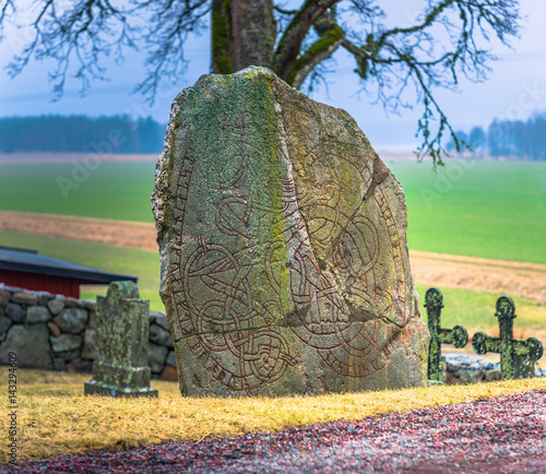 Skanela, Sweden - April 1, 2017: Viking runestone in Skanela Church, Sweden photo