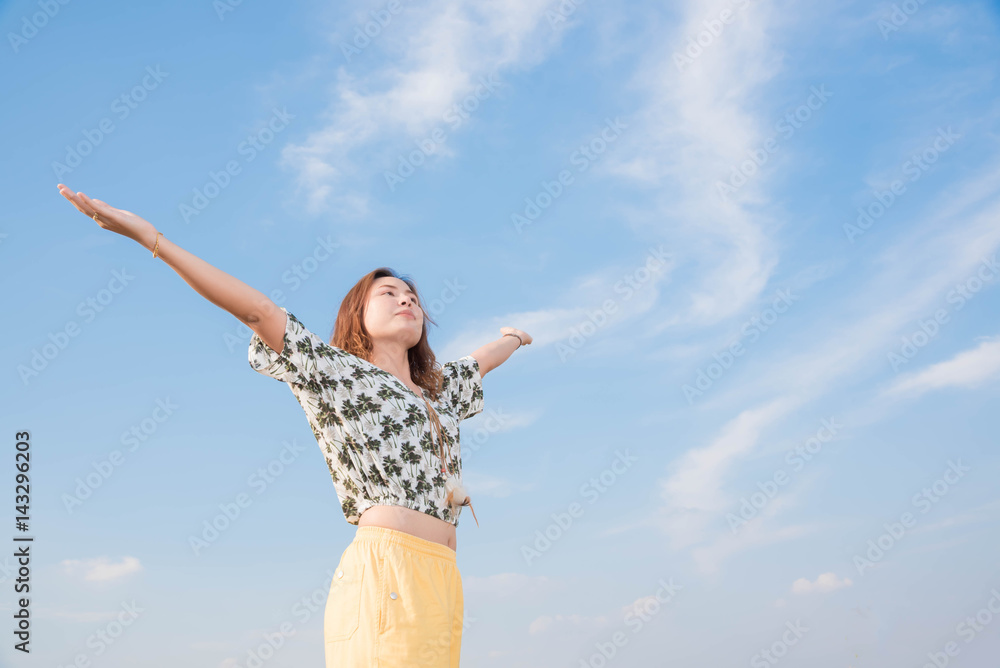 Young woman happy in summer sunlight sky outdoor. summer concept Young woman happy in summer sunlight sky outdoor. summer concept