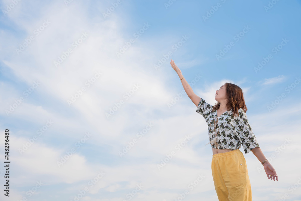Young woman happy in summer sunlight sky outdoor. summer concept Young woman happy in summer sunlight sky outdoor. summer concept
