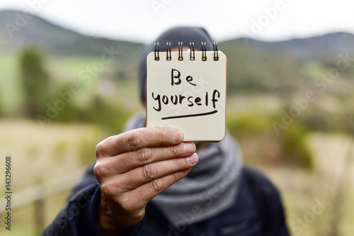 man and text be yourself in a note photo
