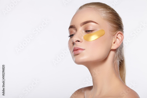 Portrait of girl with a gold patch under the eye.
