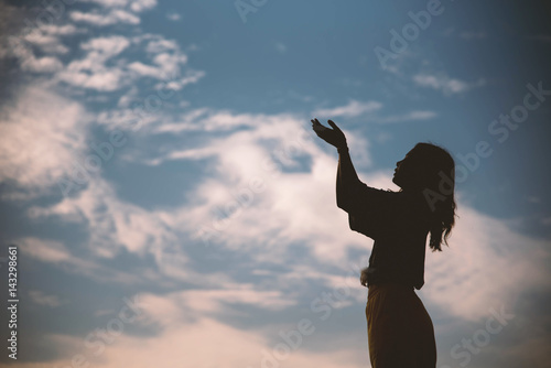 Silhouette woman sad on sunset background, hope concept