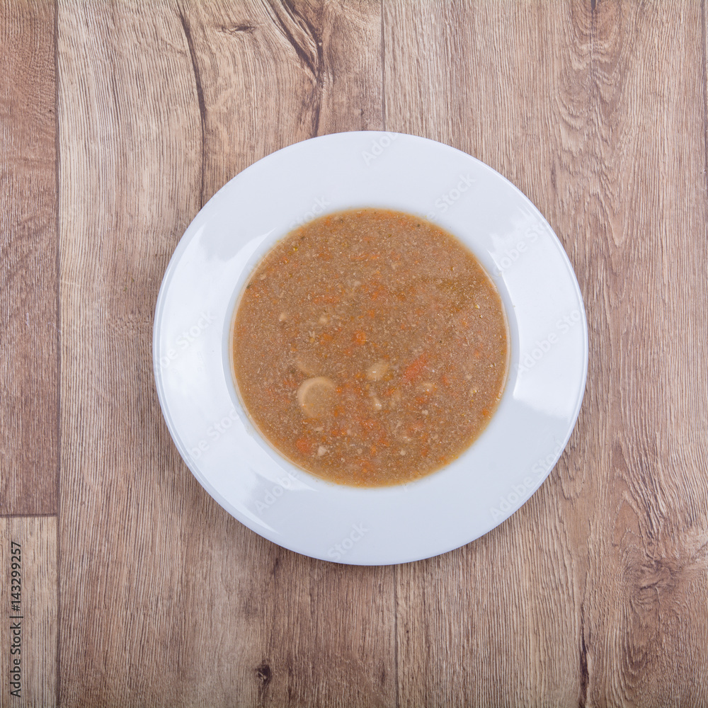 Vegetable soup on a wooden table Vegetable soup on a wooden table