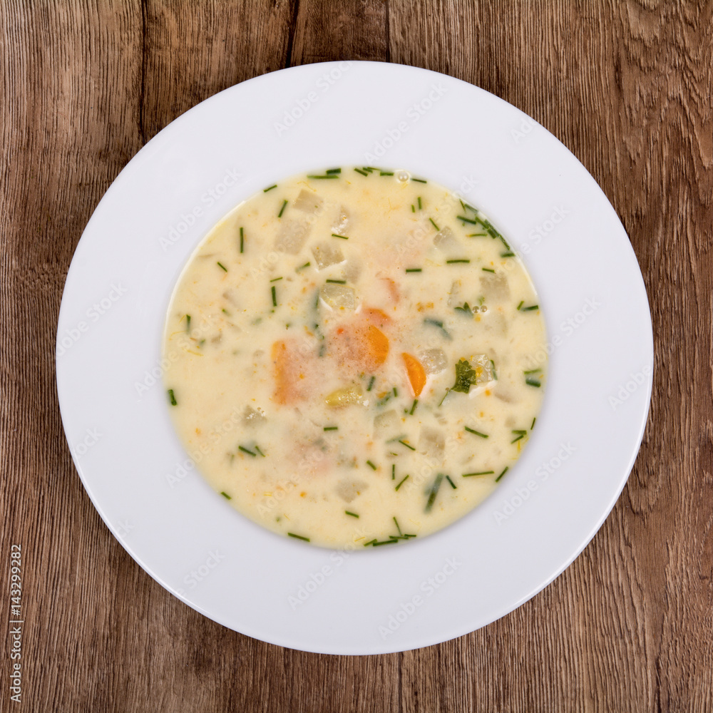 Vegetable soup on a wooden table Vegetable soup on a wooden table