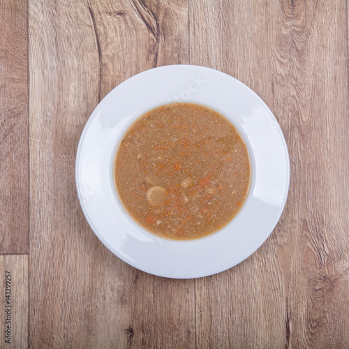 Vegetable soup on a wooden table